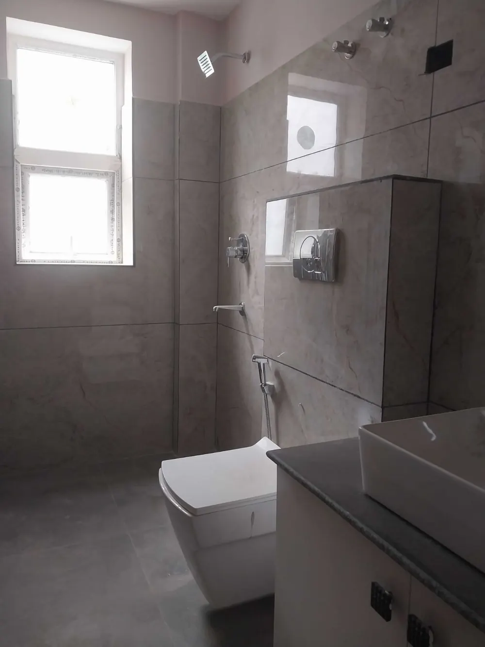 Bathroom with window, rain shower and vanity