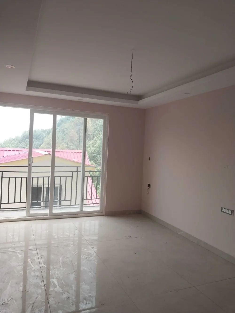 Bedroom with sliding balcony door