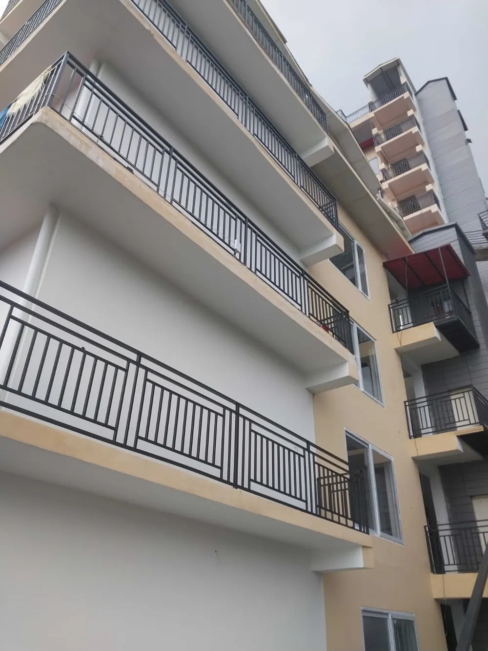 Actual site photo of the built block with balconies